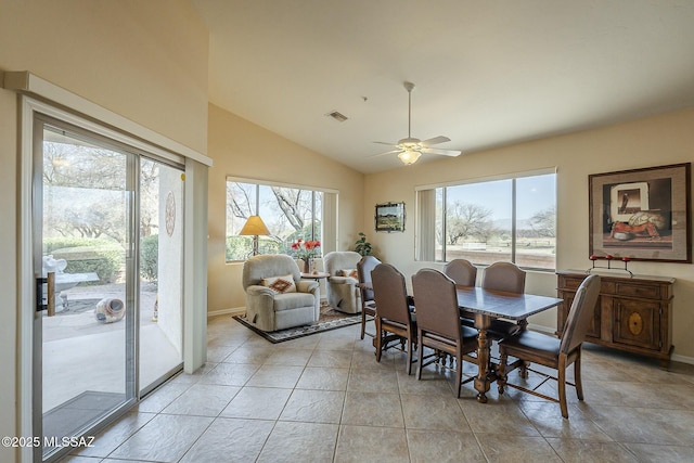 dining room with light tile patterned floors, baseboards, visible vents, lofted ceiling, and ceiling fan