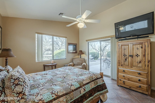 bedroom featuring access to exterior, tile patterned flooring, multiple windows, and visible vents