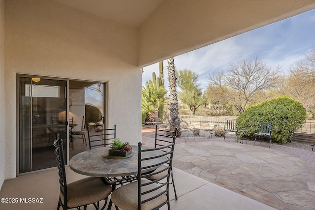 view of patio featuring outdoor dining area