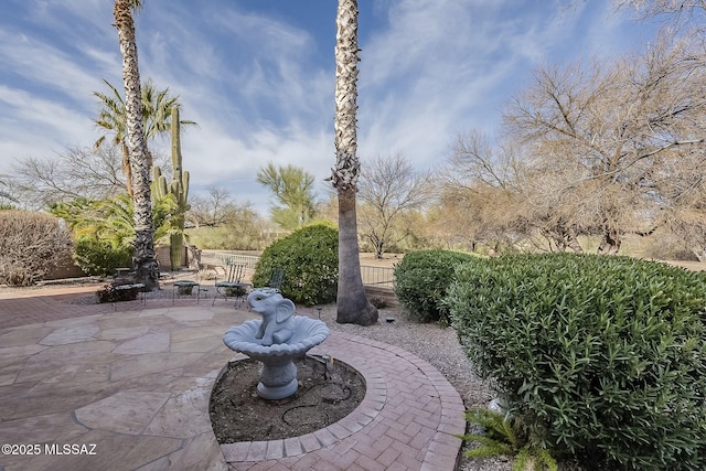 view of patio featuring fence
