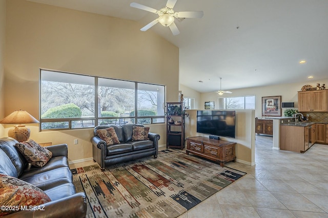 living room featuring light tile patterned floors, baseboards, and a healthy amount of sunlight