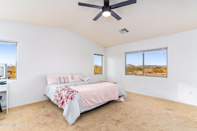 bedroom with carpet, visible vents, a ceiling fan, vaulted ceiling, and baseboards