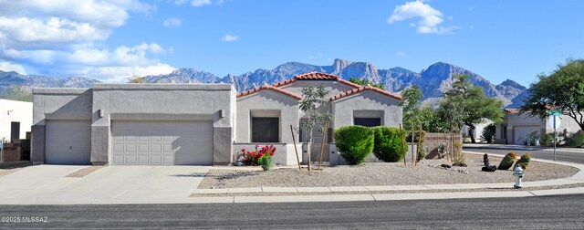 11752 N Pyramid Point Dr, Oro Valley, AZ 85737 - view of front of house featuring a mountain view and a garage