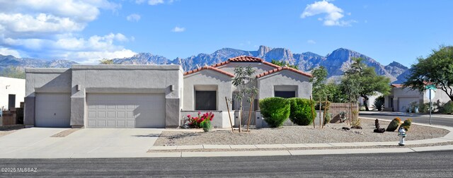 view of front of house featuring a mountain view and a garage