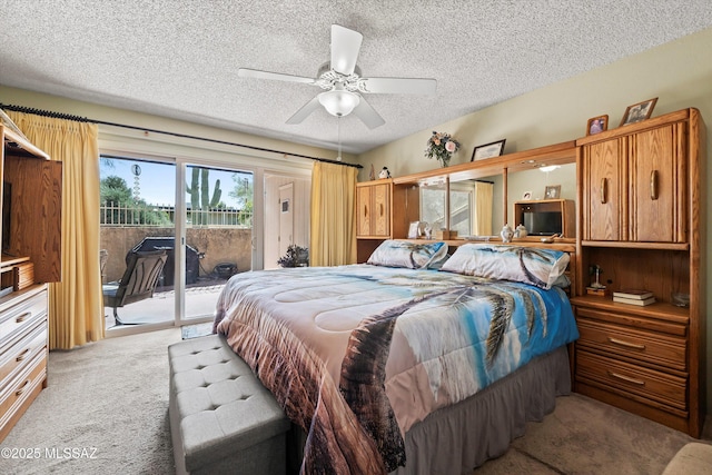 carpeted bedroom with a textured ceiling and access to exterior