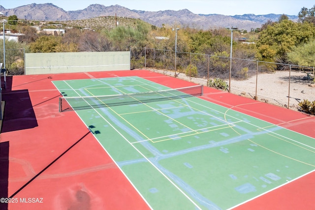 view of tennis court with a mountain view and basketball court