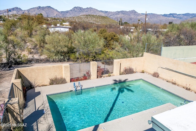 view of pool with a mountain view