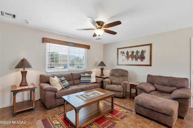 tiled living room with ceiling fan