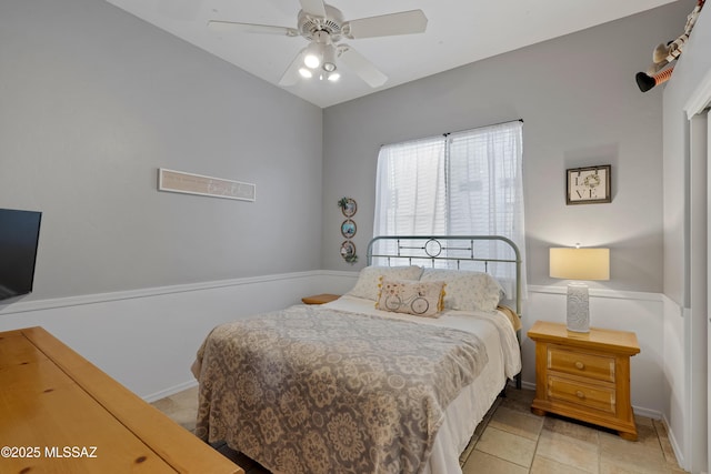 bedroom featuring a ceiling fan and light tile patterned floors