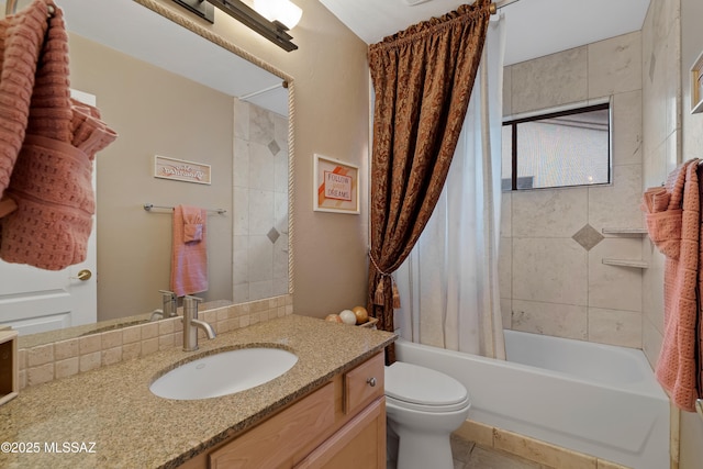 bathroom with shower / tub combo, vanity, and toilet