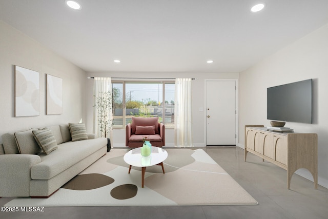 living area featuring recessed lighting and baseboards