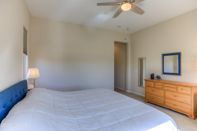 bedroom featuring light carpet and ceiling fan