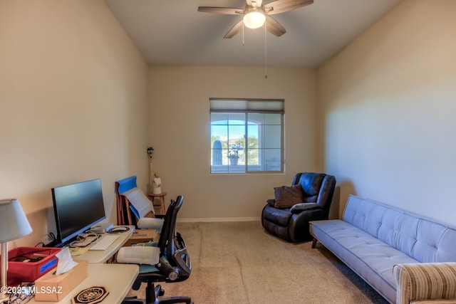 office area featuring carpet floors, a ceiling fan, and baseboards