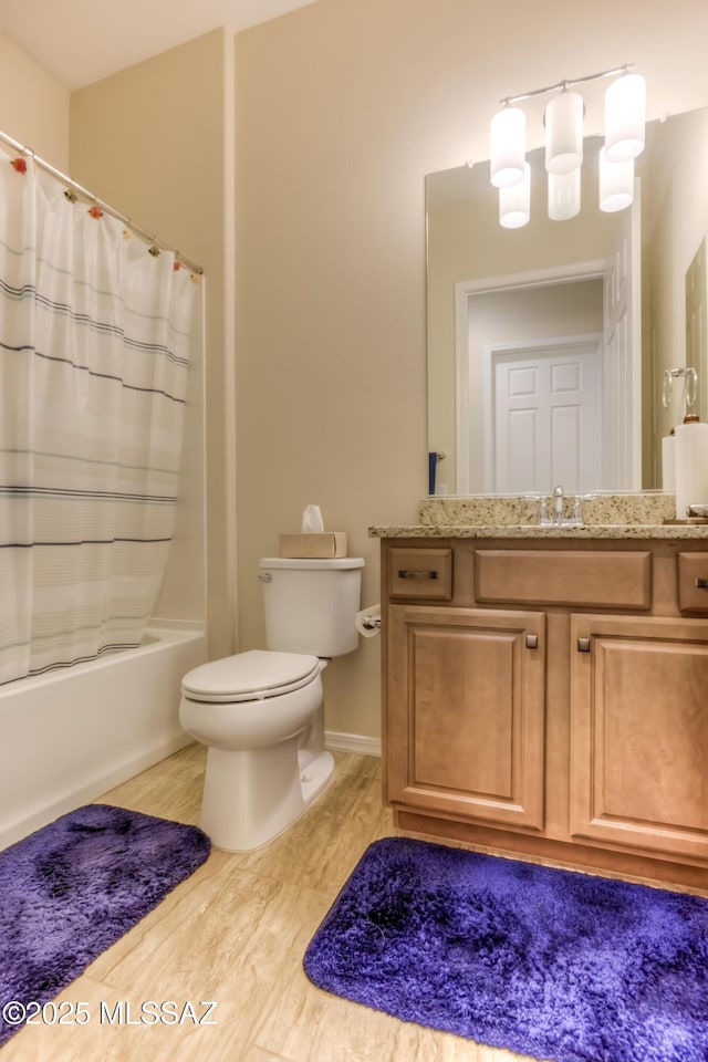 bathroom with shower / bathtub combination with curtain, vanity, toilet, and wood finished floors