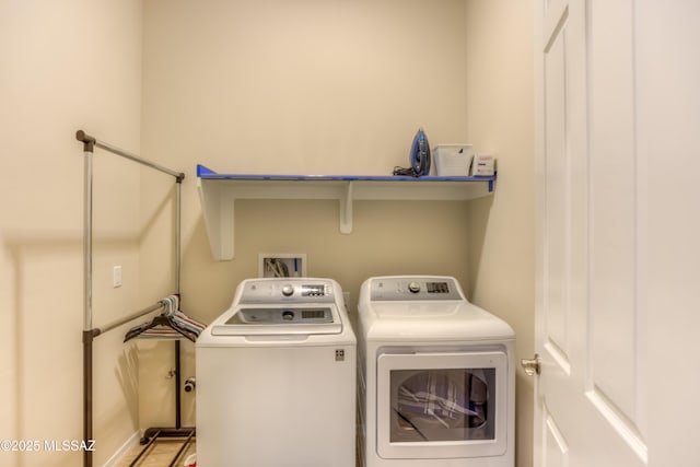 washroom featuring laundry area and separate washer and dryer