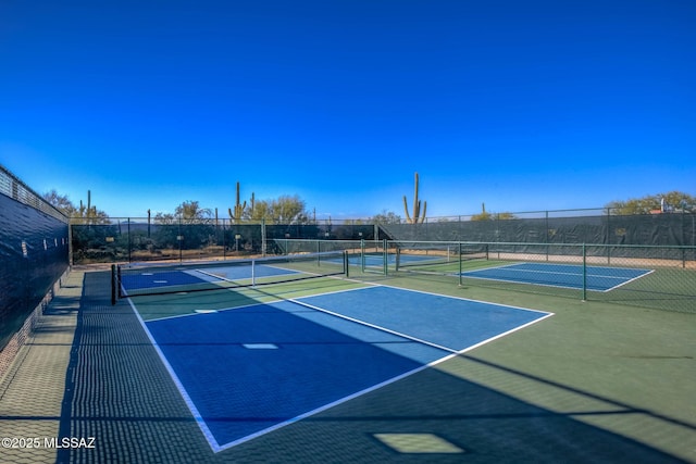 view of sport court with community basketball court and fence