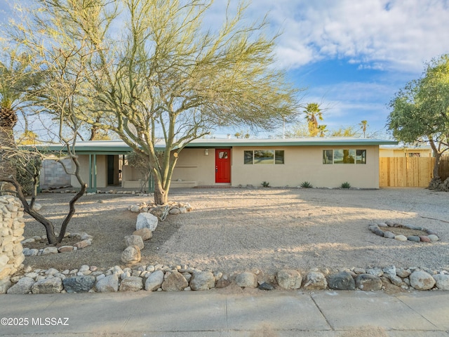 single story home featuring fence and stucco siding