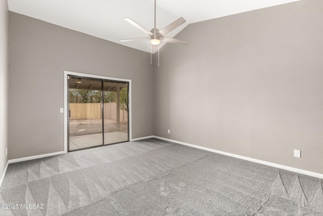 spare room with carpet flooring, a ceiling fan, baseboards, and high vaulted ceiling