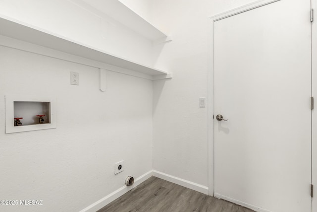 clothes washing area featuring wood finished floors, baseboards, hookup for an electric dryer, laundry area, and washer hookup