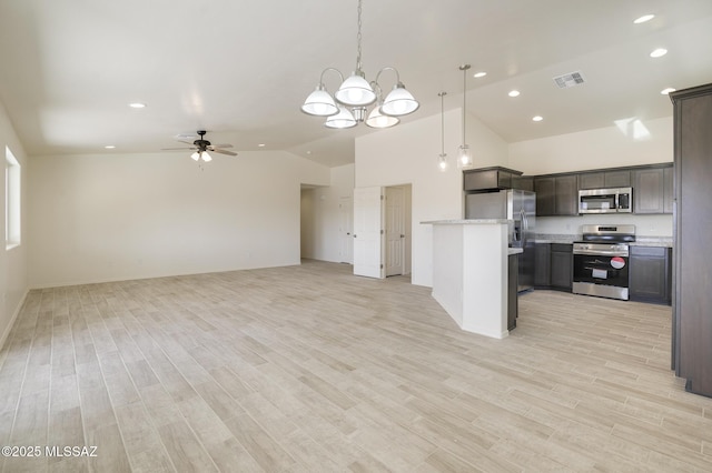 kitchen featuring appliances with stainless steel finishes, decorative light fixtures, light wood-type flooring, and ceiling fan with notable chandelier