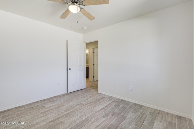 unfurnished room featuring ceiling fan and light wood-type flooring