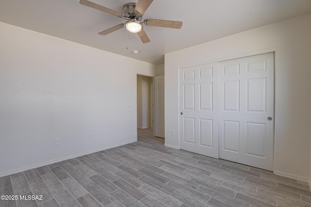 unfurnished bedroom with a closet and ceiling fan