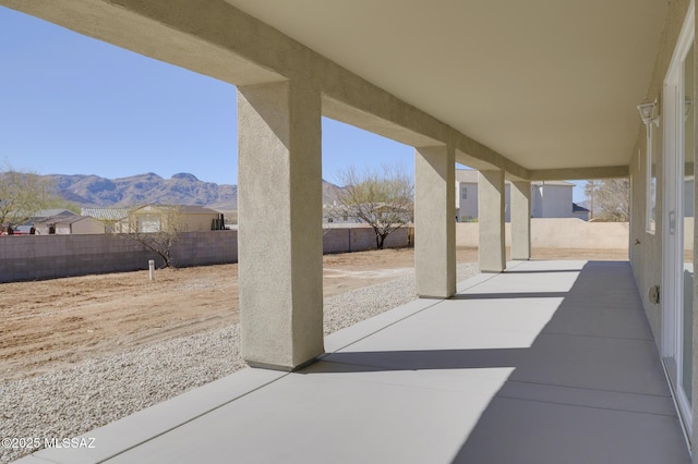 view of patio / terrace featuring a mountain view