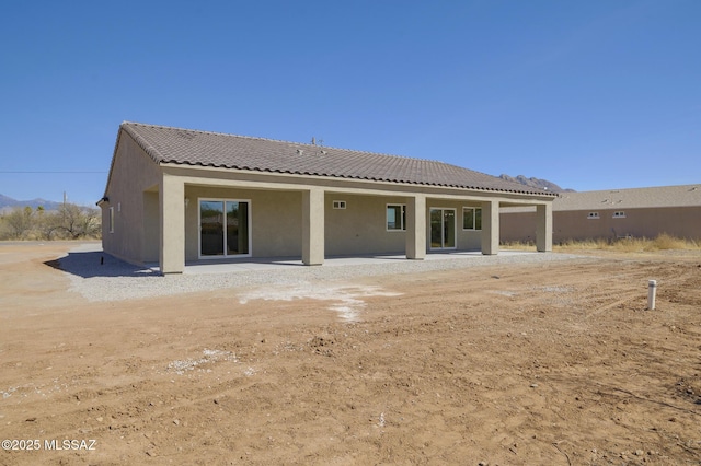 back of house with a patio area