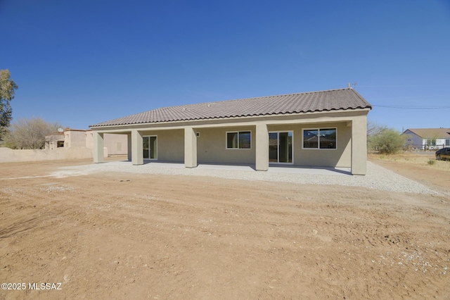 rear view of house featuring a patio