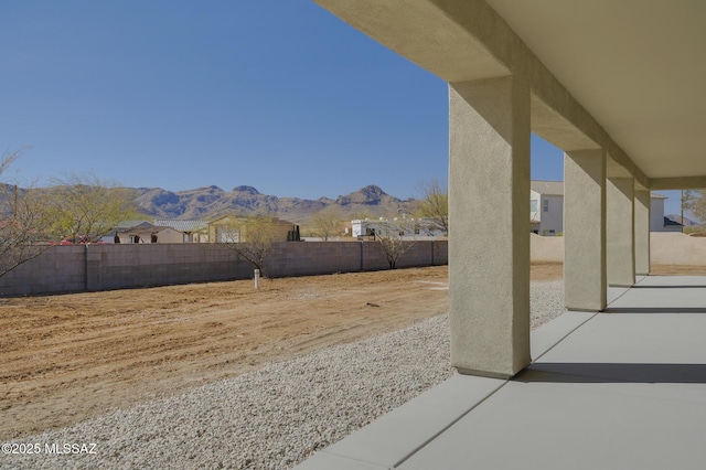 view of yard with a patio area and a mountain view