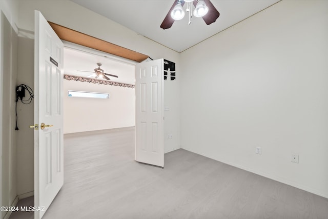 unfurnished bedroom with ceiling fan and light hardwood / wood-style floors