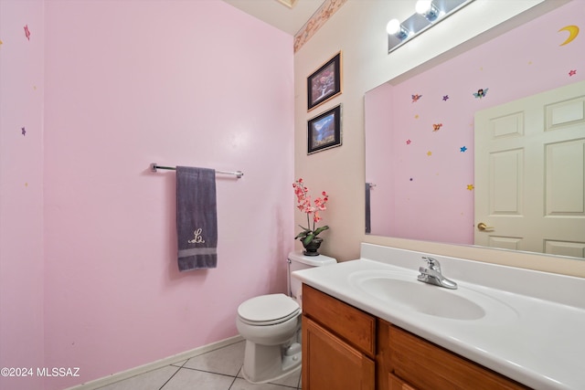 bathroom featuring vanity, toilet, and tile patterned floors