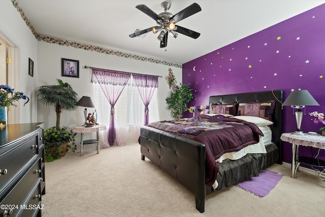 bedroom with light carpet and ceiling fan