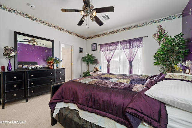 bedroom with ceiling fan and light colored carpet