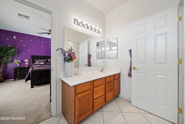 bathroom with tile patterned floors, ceiling fan, and vanity