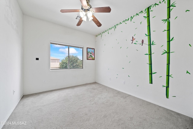 spare room with ceiling fan and carpet flooring