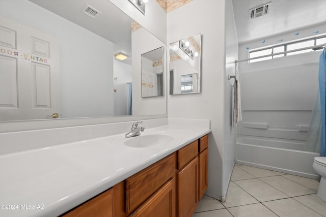 full bathroom featuring vanity, tub / shower combination, toilet, and tile patterned floors