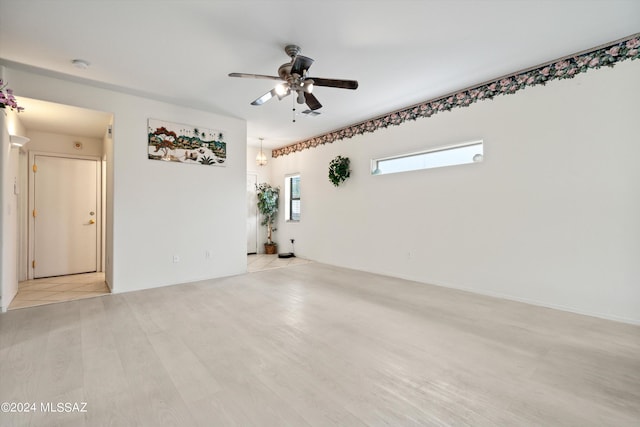 unfurnished room featuring ceiling fan and light wood-type flooring