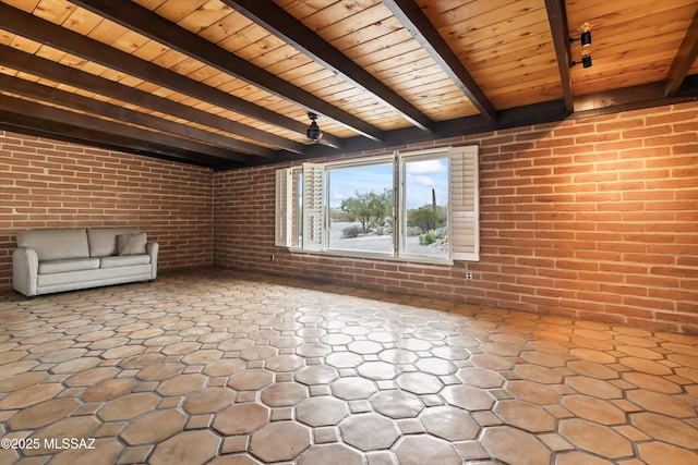 unfurnished living room featuring vaulted ceiling with beams, brick wall, and wooden ceiling