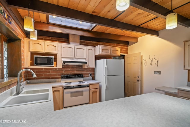 kitchen featuring wooden ceiling, hanging light fixtures, a sink, white appliances, and under cabinet range hood