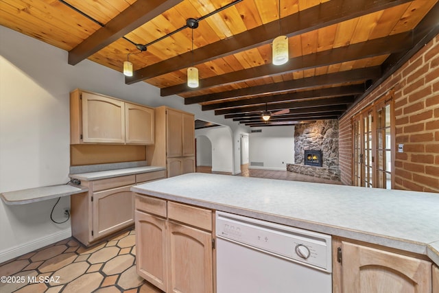 kitchen featuring wood ceiling, light countertops, dishwasher, and beamed ceiling