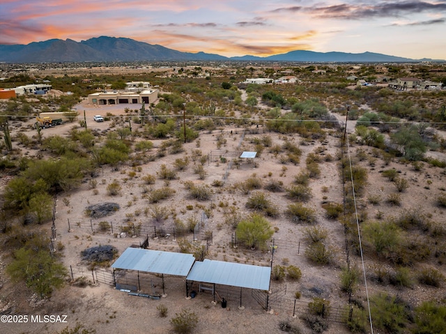 bird's eye view featuring a mountain view, a desert view, and a rural view