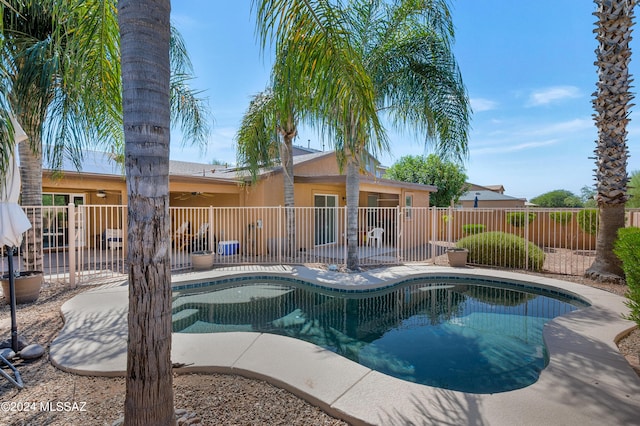 5897 E Cedarbird Dr, Tucson, AZ 85756 - view of swimming pool featuring a ceiling fan and a patio area