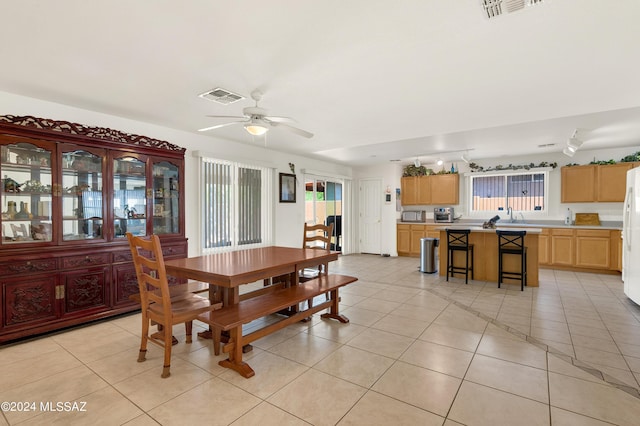 5897 E Cedarbird Dr, Tucson, AZ 85756 - dining space featuring a ceiling fan and light tile patterned flooring