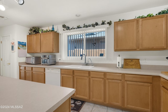 5897 E Cedarbird Dr, Tucson, AZ 85756 - kitchen with white appliances, a sink, and light countertops