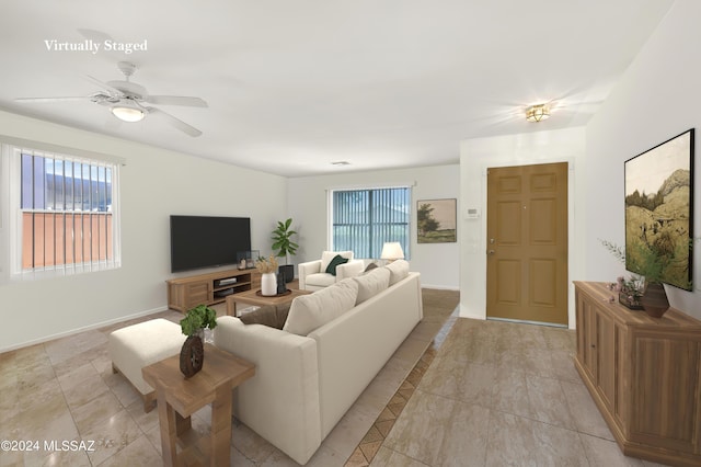 5897 E Cedarbird Dr, Tucson, AZ 85756 - living room with healthy amount of natural light, a ceiling fan, and baseboards