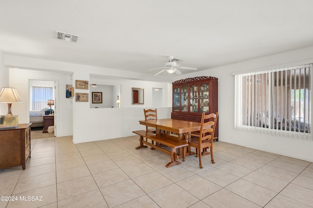 5897 E Cedarbird Dr, Tucson, AZ 85756 - dining room featuring plenty of natural light, a ceiling fan, and light tile patterned floors