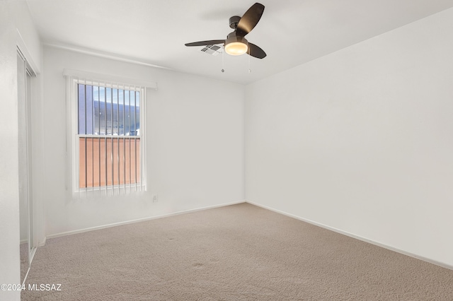 5897 E Cedarbird Dr, Tucson, AZ 85756 - spare room featuring a ceiling fan, carpet flooring, and baseboards
