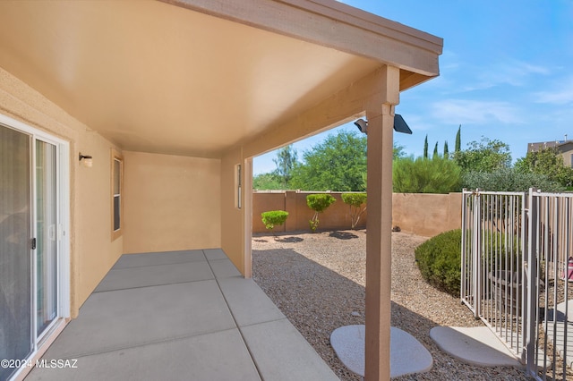 5897 E Cedarbird Dr, Tucson, AZ 85756 - fenced backyard with a patio area