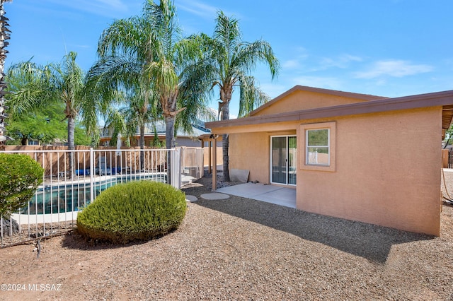 5897 E Cedarbird Dr, Tucson, AZ 85756 - fenced backyard with a patio area